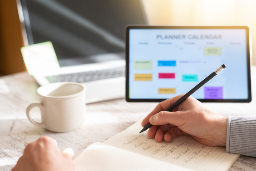 A professional creating a to-do list and task tracker