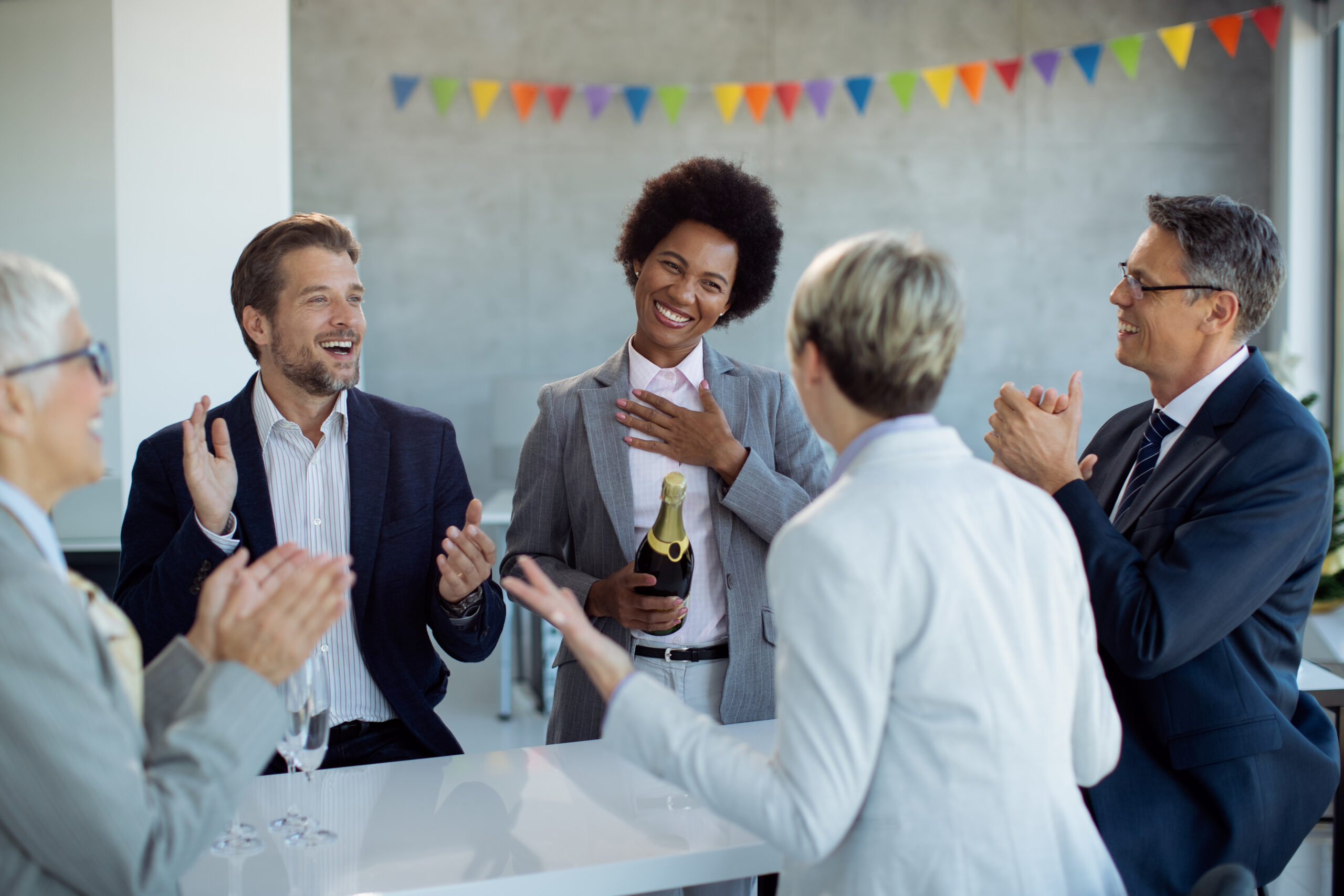 Sales agents celebrating achieving their goals